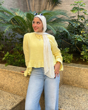 Sunbeam Top Butter Yellow three-quarter view in outdoor setting