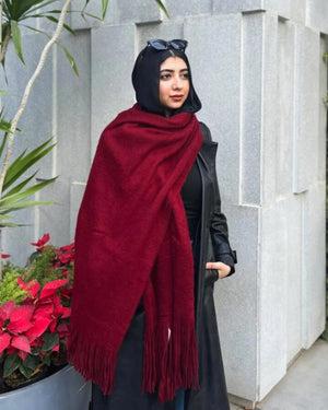Burgundy mohair shawl draped elegantly showing soft texture and fringe detailing