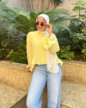 Sunbeam Top Butter Yellow smiling editorial pose in garden